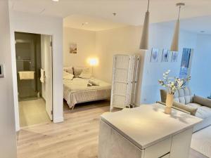 Ένα ή περισσότερα κρεβάτια σε δωμάτιο στο NEW Top Floor L70 CBD Luxury Apt +31 φωτογραφίες