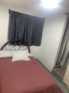 מיטה או מיטות בחדר ב-Alojamiento Morelos
