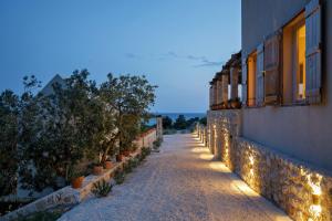 a street with plants on the side of a building at Villa Vito in Hvar
