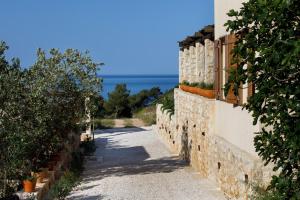 a road leading to the ocean on a house at Villa Vito in Hvar