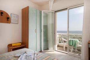 A bed or beds in a room at Hotel Cigno D'Oro