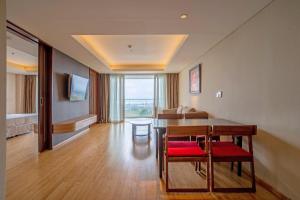 a living room with a table and a couch at Four Points by Sheraton Bali, Ungasan in Jimbaran