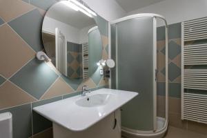 a bathroom with a sink and a mirror at Casa Mia Milos in Paleochori +11 photos