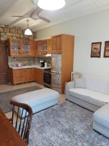 a kitchen with two twin beds in a room at The Stone Heaven in Galíni