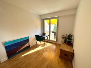 a room with a desk with a laptop on it at Cosy, calm 70m2, 2 bedroom flat. in Paris