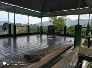 a pavilion with a view of a mountain at Rohana Estate Lodging & Camping in Kandy