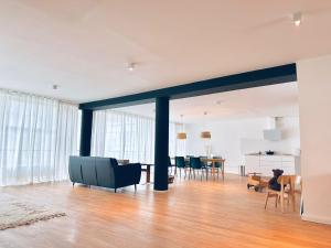 a living room with a couch and a table at Emmas Lofts in Essen