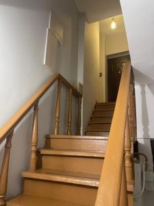 a staircase in a house with a stair case at Apartment On Botanikuri 17 in Tbilisi City