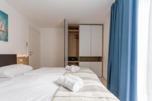 Postel nebo postele na pokoji v ubytování Garden Palace - Da Matteo Deluxe Apartment