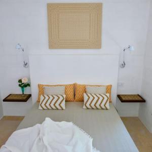 Masseria Pezze Galere-La Casa del Fico con piscina idromassaggio privata tesisinde bir odada yatak veya yataklar
