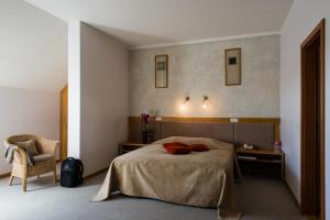 Postel nebo postele na pokoji v ubytování Hotel Sanvilla