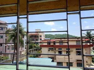 a view of a building from a window at Kaveri home stays in Guwahati
