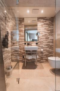 Ein Badezimmer in der Unterkunft H5 Grauer Bär Studios & More