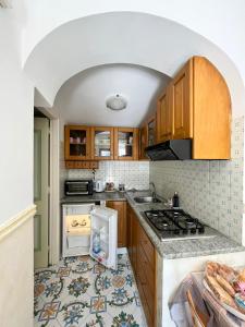Кухня или мини-кухня в Casa Tutti Frutti
