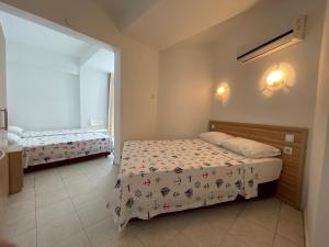 Postel nebo postele na pokoji v ubytování Hotel Status
