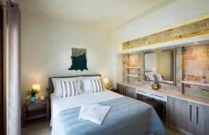 En eller flere senge i et værelse på Muses Beach Villas - Urania