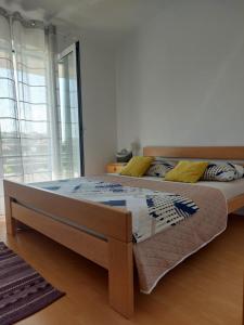 Postel nebo postele na pokoji v ubytování Apartment Dario