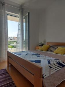 Postel nebo postele na pokoji v ubytování Apartment Dario