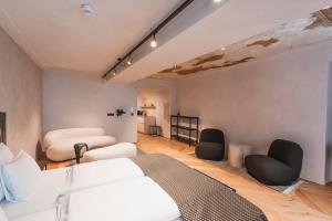 Ein Bett oder Betten in einem Zimmer der Unterkunft H5 Grauer Bär Studios & More