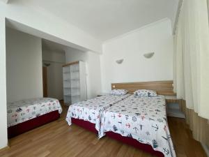 Postel nebo postele na pokoji v ubytování Hotel Status