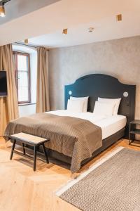 Ein Bett oder Betten in einem Zimmer der Unterkunft H5 Grauer Bär Studios & More