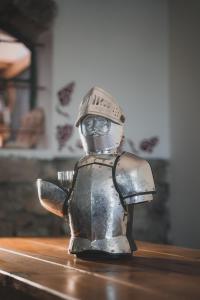 a metal robot is sitting on a table at Chata - Sklep 57 in Starovice