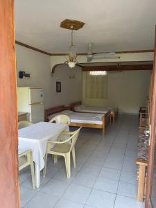 a room with two tables and a bed in it at Exohi apartments in Vrasná