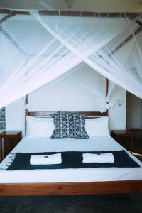 Postel nebo postele na pokoji v ubytování Komba on the Rocks