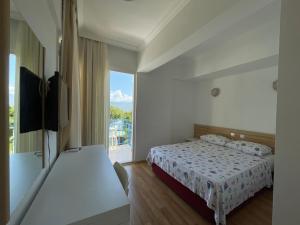 Postel nebo postele na pokoji v ubytování Hotel Status