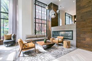 a living room with a couch and a fireplace at Tribeca Studio w Pool Roofdeck Gym View NYC-273 in New York