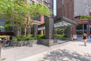 a sculpture on a sidewalk in a city at Tribeca Studio w Pool Roofdeck Gym View NYC-273 in New York
