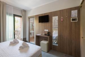 Un ou plusieurs lits dans un hébergement de l'établissement Hotel Marco Polo