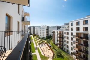 a view from the balcony of a apartment building at Wola Skwer Happy Apartment in Warsaw