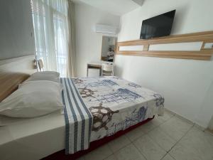 Postel nebo postele na pokoji v ubytování Hotel Status