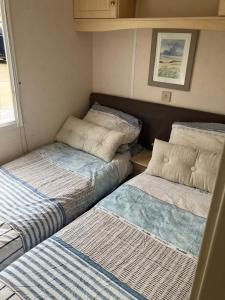 מיטה או מיטות בחדר ב-Chalet Stal Veersedam