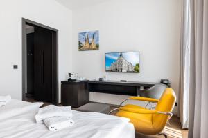 Postel nebo postele na pokoji v ubytování Theresian Hotel