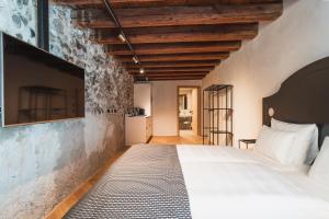 Ein Bett oder Betten in einem Zimmer der Unterkunft H5 Grauer Bär Studios & More