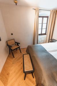 Ein Bett oder Betten in einem Zimmer der Unterkunft H5 Grauer Bär Studios & More
