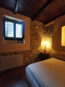 Postel nebo postele na pokoji v ubytování VILLA ALESSI - dimora storica