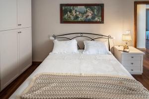a bedroom with a bed and a painting on the wall at Panoramic apartment in Massa