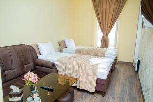 Ένα ή περισσότερα κρεβάτια σε δωμάτιο στο VN Hotel Vanadzor