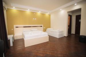 Postel nebo postele na pokoji v ubytování Hotel Irise