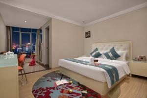 Postelja oz. postelje v sobi nastanitve Kaiserdom Hotel Baiyun Airport-24-hour Airport-Free shuttle bus