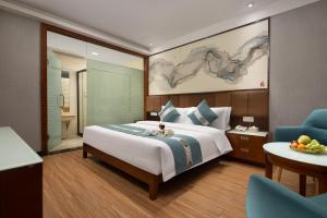 Postelja oz. postelje v sobi nastanitve Kaiserdom Hotel Baiyun Airport-24-hour Airport-Free shuttle bus
