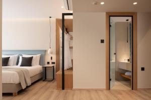 Postel nebo postele na pokoji v ubytování Hotel Ideon