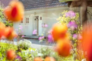 a house with flowers in front of it at Ferienhaus Lienz in Lienz