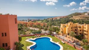 a view of a resort with a swimming pool at Coto Real Thasos 222 in Manilva