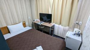 Uma televisão e/ou sistema de entretenimento em Select Inn Shimada Ekimae