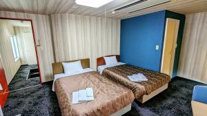 Un pat sau paturi într-o cameră la Select Inn Shimada Ekimae +30 fotografii