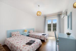 Ένα ή περισσότερα κρεβάτια σε δωμάτιο στο Casa da Praia